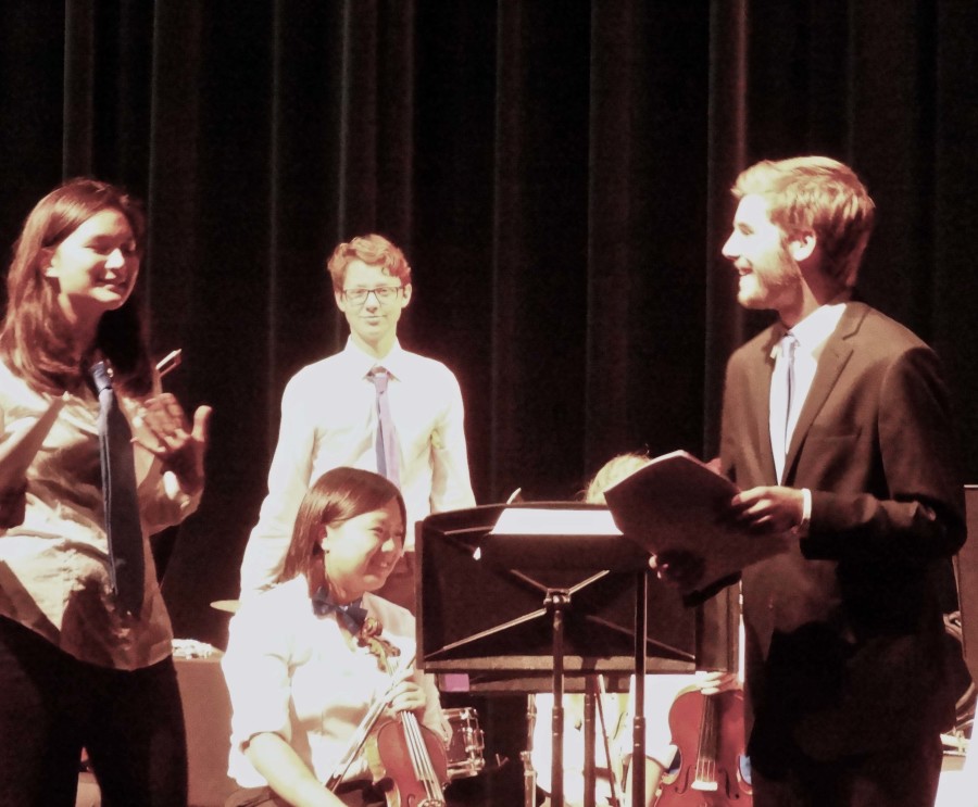 Aspen Adams and Nathan Smith are seen introducing the next song in the concert. 