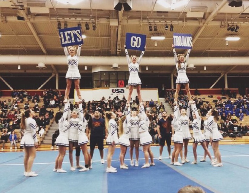 TL Cheer team stunting at a competition