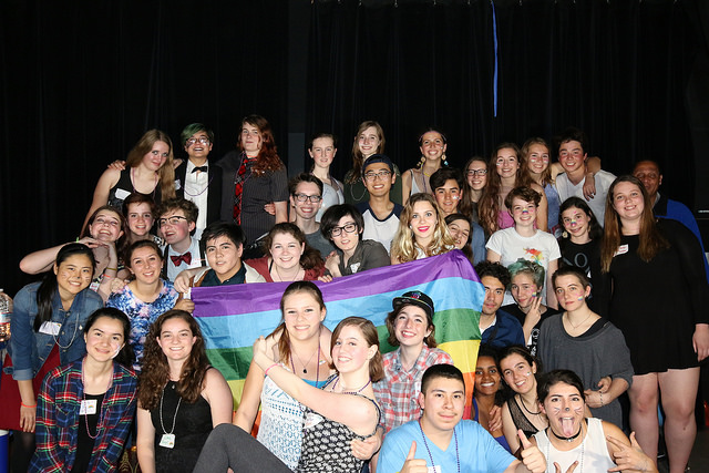 The GSA club and other attendees take a group picture at the dance!